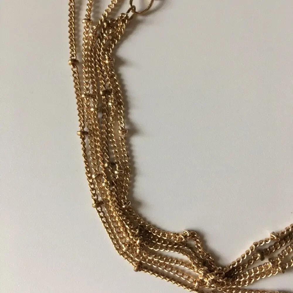 Boho gold tone three strand layered necklace